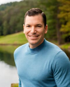 Automated bidding in Google Ads explained by Neil Colvin while hanging out at a lake.