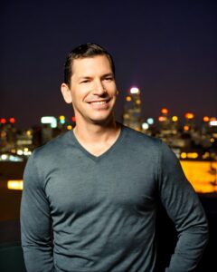 Neil Colvin, explains How To Rank Higher On Google, while at rooftop event.